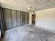 A bright living room shows exposed concrete and bare studs in the wall. The room is unfinished at 2621 Cove Cay Dr # 206, Clearwater, FL 33760