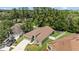 Aerial view of a beautiful home, showcasing its well-maintained lawn and landscaping at 26749 Middleground Loop, Wesley Chapel, FL 33544