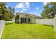 This home features a large backyard with a screened-in porch at 26749 Middleground Loop, Wesley Chapel, FL 33544