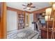 Functional bedroom features built-in shelving and desk with ample storage at 26749 Middleground Loop, Wesley Chapel, FL 33544