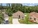 Charming single-story home with a well-manicured lawn, inviting entryway, and a concrete driveway for easy access at 26749 Middleground Loop, Wesley Chapel, FL 33544