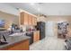 Bright kitchen with light wood cabinetry, black appliances, and tile flooring for a modern feel at 26749 Middleground Loop, Wesley Chapel, FL 33544