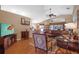 Spacious living room with vaulted ceilings, hardwood floors, and large windows for natural light at 26749 Middleground Loop, Wesley Chapel, FL 33544