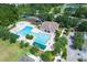 Aerial view of the pool and playground provides a resort-like feel in this sought-after community at 26749 Middleground Loop, Wesley Chapel, FL 33544