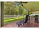 Outdoor porch features tile floors and ceiling fans for comfortable outdoor living at 26749 Middleground Loop, Wesley Chapel, FL 33544