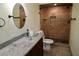 Updated bathroom featuring a glass vessel sink, stone countertops, and tiled shower at 2841 S Cranberry Blvd, North Port, FL 34286