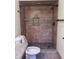 Tiled bathroom with a large shower, stone floors, and updated fixtures at 2841 S Cranberry Blvd, North Port, FL 34286