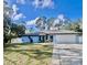 Charming single-story home featuring a two-car garage and a well-maintained front yard at 2841 S Cranberry Blvd, North Port, FL 34286