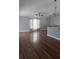Open-concept living room with hardwood floors and plenty of natural light at 2841 S Cranberry Blvd, North Port, FL 34286