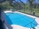 Sparkling in-ground screened pool with hot tub offers a private backyard oasis at 2841 S Cranberry Blvd, North Port, FL 34286