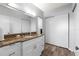 Bathroom with updated vanity, granite countertop, and ample storage at 30 Turner St # 704, Clearwater, FL 33756