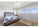 Comfortable bedroom featuring a large window and updated wood-look flooring at 30 Turner St # 704, Clearwater, FL 33756