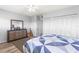 Bright bedroom with a large closet, stylish dresser, and comfortable bedspread at 30 Turner St # 704, Clearwater, FL 33756