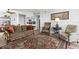 Inviting living area with beautiful rug, stylish seating, and a glimpse of the adjacent kitchen at 30 Turner St # 704, Clearwater, FL 33756
