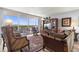 Cozy living room showcasing comfortable seating, large windows, and an outdoor patio with scenic views at 30 Turner St # 704, Clearwater, FL 33756