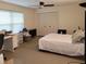 Clean bedroom features a ceiling fan and large closet at 3200 Sandy Ridge Dr, Clearwater, FL 33761