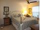 Comfortable bedroom with a ceiling fan, a queen bed, and a window at 3200 Sandy Ridge Dr, Clearwater, FL 33761