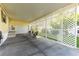 Spacious carport with lattice work, with space for parking and outdoor seating at 37338 Sandra Ave, Zephyrhills, FL 33542