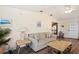 Inviting living area with a comfortable couch, side tables, and light, airy decor at 37338 Sandra Ave, Zephyrhills, FL 33542