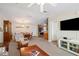 Open living area with cozy seating leading to the dining area and kitchen at 37338 Sandra Ave, Zephyrhills, FL 33542