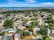 Aerial view showcasing the neighborhood, the property's backyard pool, and mature trees surrounding the home at 3749 Mckay Creek Dr, Largo, FL 33770