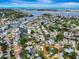 Aerial view of the property and its neighborhood close to the water in a beautiful waterfront community at 3749 Mckay Creek Dr, Largo, FL 33770