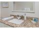 Bathroom features granite countertop, updated fixtures, and decorative mirror at 3749 Mckay Creek Dr, Largo, FL 33770