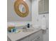Well-organized bathroom vanity with fresh towels and decorative mirror at 3749 Mckay Creek Dr, Largo, FL 33770