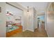 Open foyer view of living area and kitchen; hardwood floors and neutral paint at 3749 Mckay Creek Dr, Largo, FL 33770