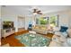 Comfortable living room with ceiling fan, plush seating, and natural light, creating a warm atmosphere at 3749 Mckay Creek Dr, Largo, FL 33770