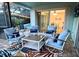 Enclosed patio with comfortable seating, ceiling fan, and views of the pool at 3749 Mckay Creek Dr, Largo, FL 33770