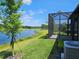Beautiful backyard with a screened-in lanai and a tranquil lake view, ideal for outdoor living at 3776 Maxwell Park Dr, Sun City Center, FL 33573
