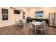 A modern community room with stainless steel appliances and seating for residents provides comfortable, shared space at 3776 Maxwell Park Dr, Sun City Center, FL 33573