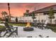Inviting outdoor area features a cozy fire pit and comfortable seating for relaxed evenings at 3776 Maxwell Park Dr, Sun City Center, FL 33573