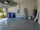 Garage featuring a sealed concrete floor and an open garage door at 3776 Maxwell Park Dr, Sun City Center, FL 33573