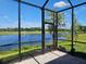 Relaxing screened lanai with stunning views of the lake and golf course beyond at 3776 Maxwell Park Dr, Sun City Center, FL 33573