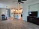 Open-concept living space with hardwood floors, stainless steel appliances, and an eat-in kitchen at 3776 Maxwell Park Dr, Sun City Center, FL 33573