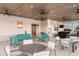 Comfortable poolside lounge with plush sofas, tables, and outdoor seating, perfect for community gatherings at 3776 Maxwell Park Dr, Sun City Center, FL 33573