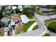 An aerial view of the neighborhood features a tree-lined street and proximity to community amenities at 3951 72Nd N St, St Petersburg, FL 33709