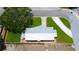 Aerial view of a home showing a large, landscaped yard and a driveway with ample parking space at 3951 72Nd N St, St Petersburg, FL 33709