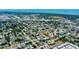 This aerial view shows the homes neighborhood with its tree lined streets, waterways, and parks at 3951 72Nd N St, St Petersburg, FL 33709