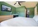 Serene bedroom featuring a large bed, TV, and natural light from the window at 3951 72Nd N St, St Petersburg, FL 33709