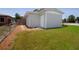 Well-maintained home exterior showcasing a tidy yard, a charming path, and access to a serene outdoor space at 3951 72Nd N St, St Petersburg, FL 33709