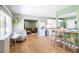 Open-concept space showcasing light wood floors, cozy seating, and seamless flow into the kitchen at 3951 72Nd N St, St Petersburg, FL 33709