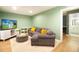 Cozy living room featuring a comfortable gray sofa, a modern TV, and stylish décor at 3951 72Nd N St, St Petersburg, FL 33709