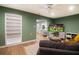 Inviting living room with built-in shelving, hardwood floors and modern decor at 3951 72Nd N St, St Petersburg, FL 33709