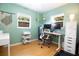 Functional home office with dual monitors, ergonomic chair, and plenty of natural light for a productive workspace at 3951 72Nd N St, St Petersburg, FL 33709