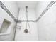 Shower features tiled walls, showerhead, and built-in shelving at 3951 72Nd N St, St Petersburg, FL 33709