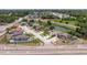 Aerial view of a home on the corner of a neighborhood with a river nearby at 4555 Hannah Ln, St Petersburg, FL 33709