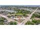 Aerial view showcases the neighborhood with home near a river and roadways at 4555 Hannah Ln, St Petersburg, FL 33709
